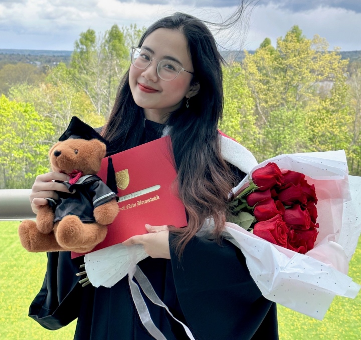 Khanh receiving her diploma from the University of New Brunswick, Canada, in May